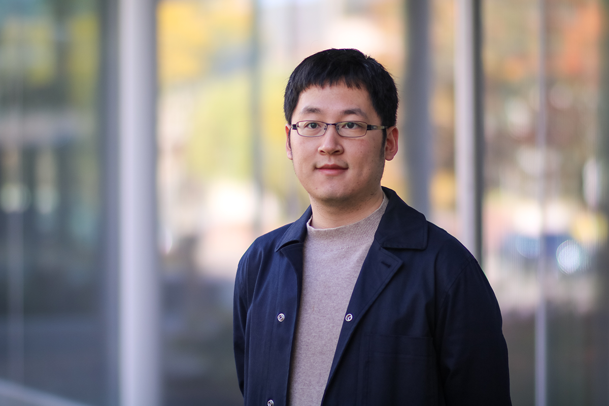 CID student fellow Junchao Tang stands in front of the LSA building.