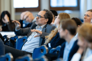 CID Faculty Pablo Mitnik listens to a session at the RC28 Summer Conference